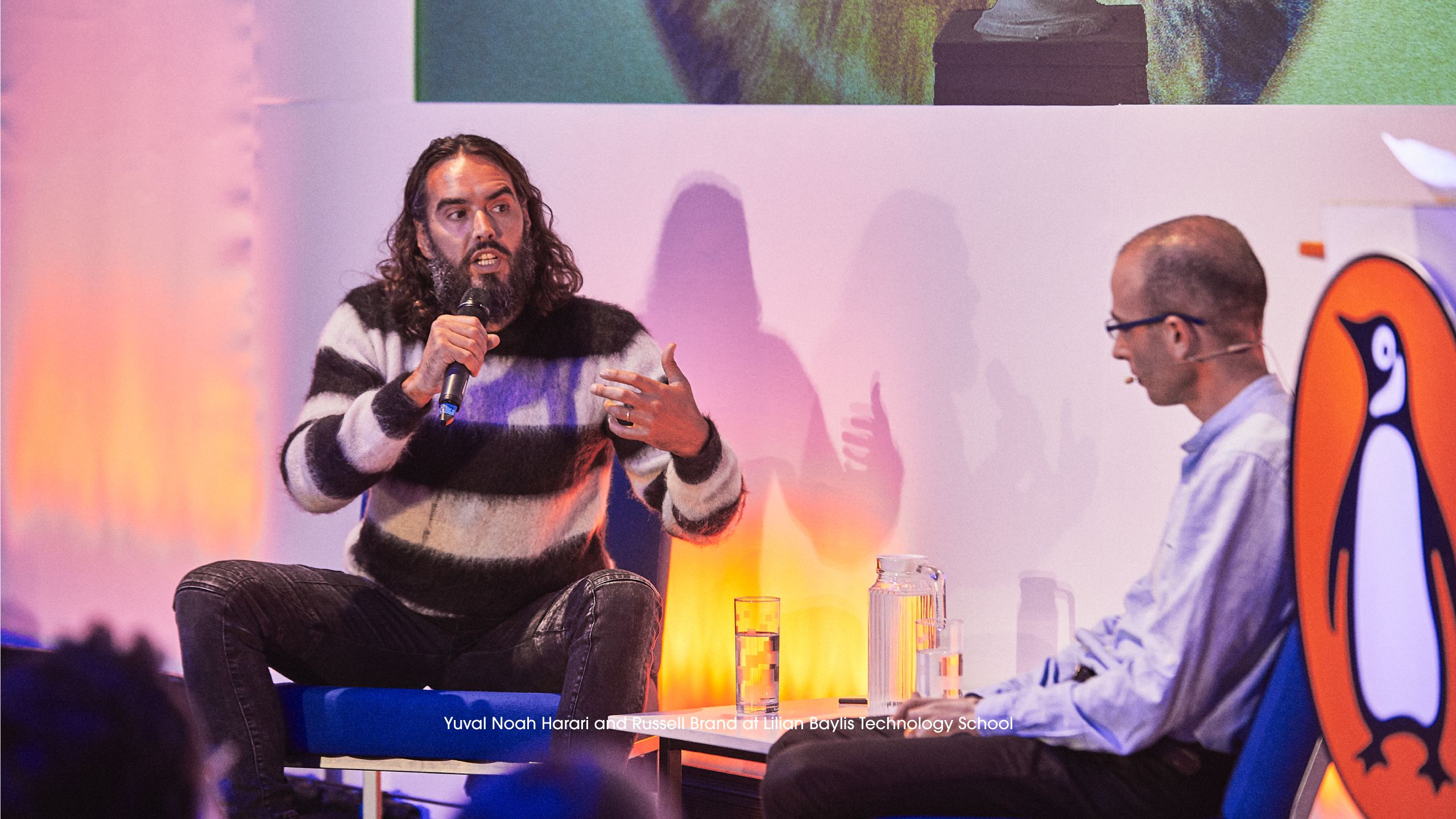 Russell Brand and Yuval Noah Harari at Penguin Talks in the Lilian Baylis Technology School