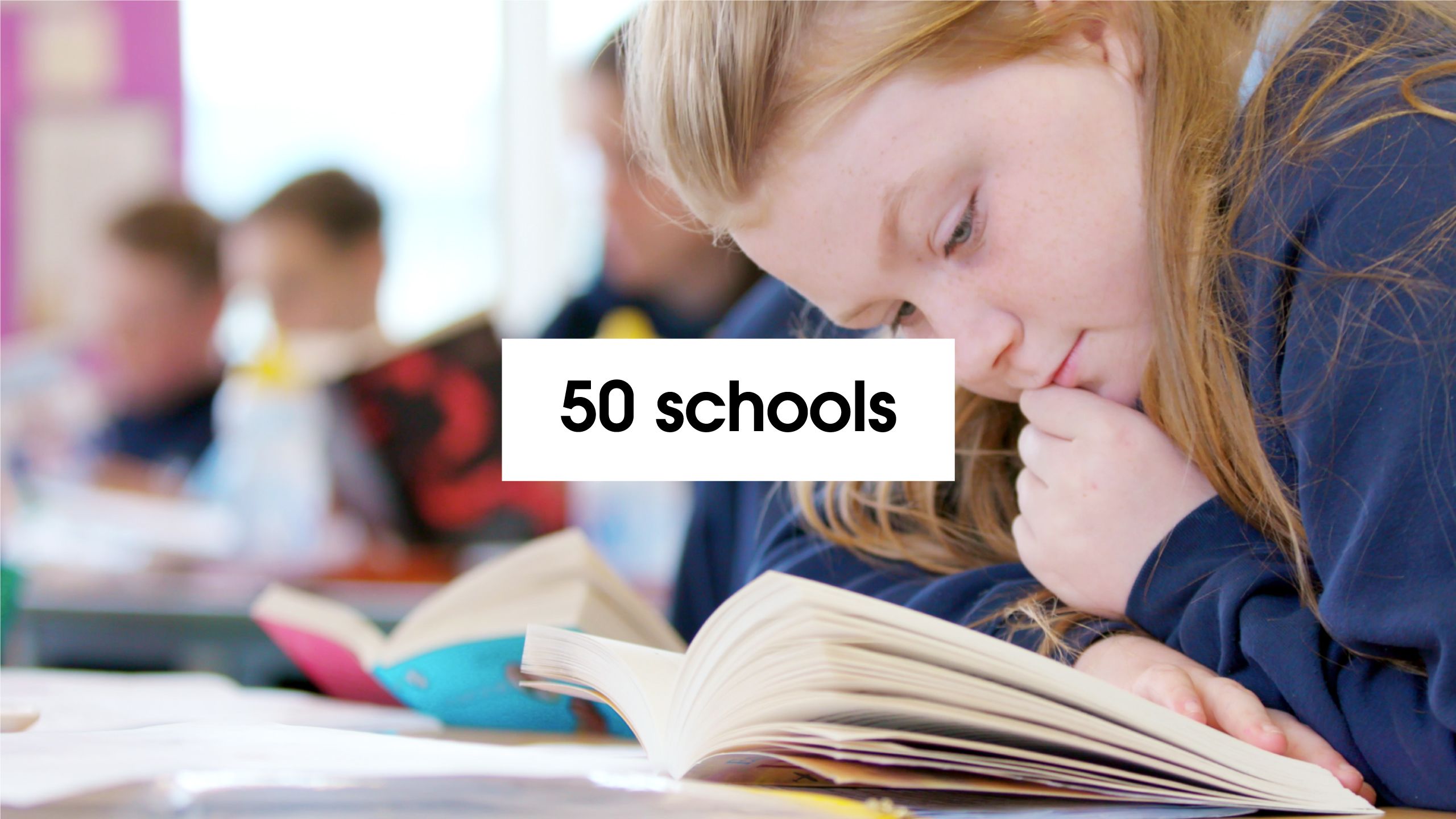 '50 schools' – with background of girl reading as part of Puffin World of Stories
