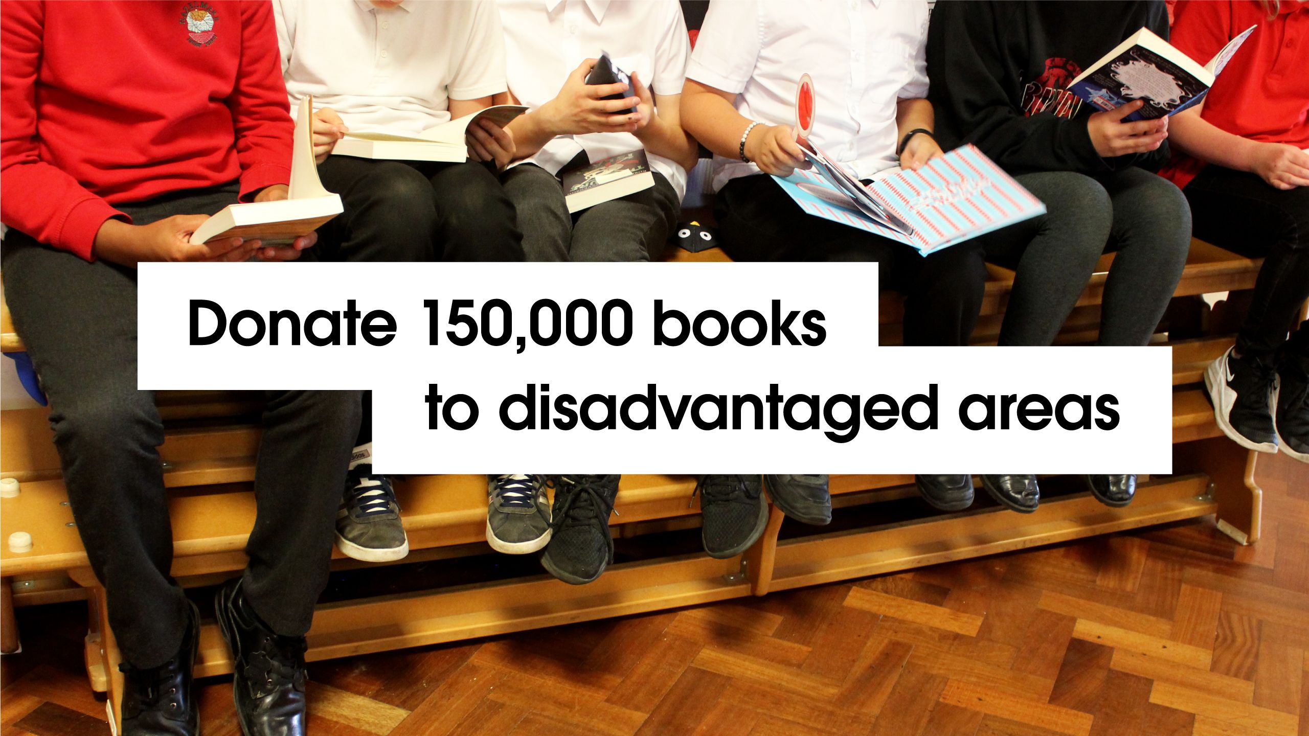 'Donate 150,000 books to disadvantaged areas' with image background of children reading books