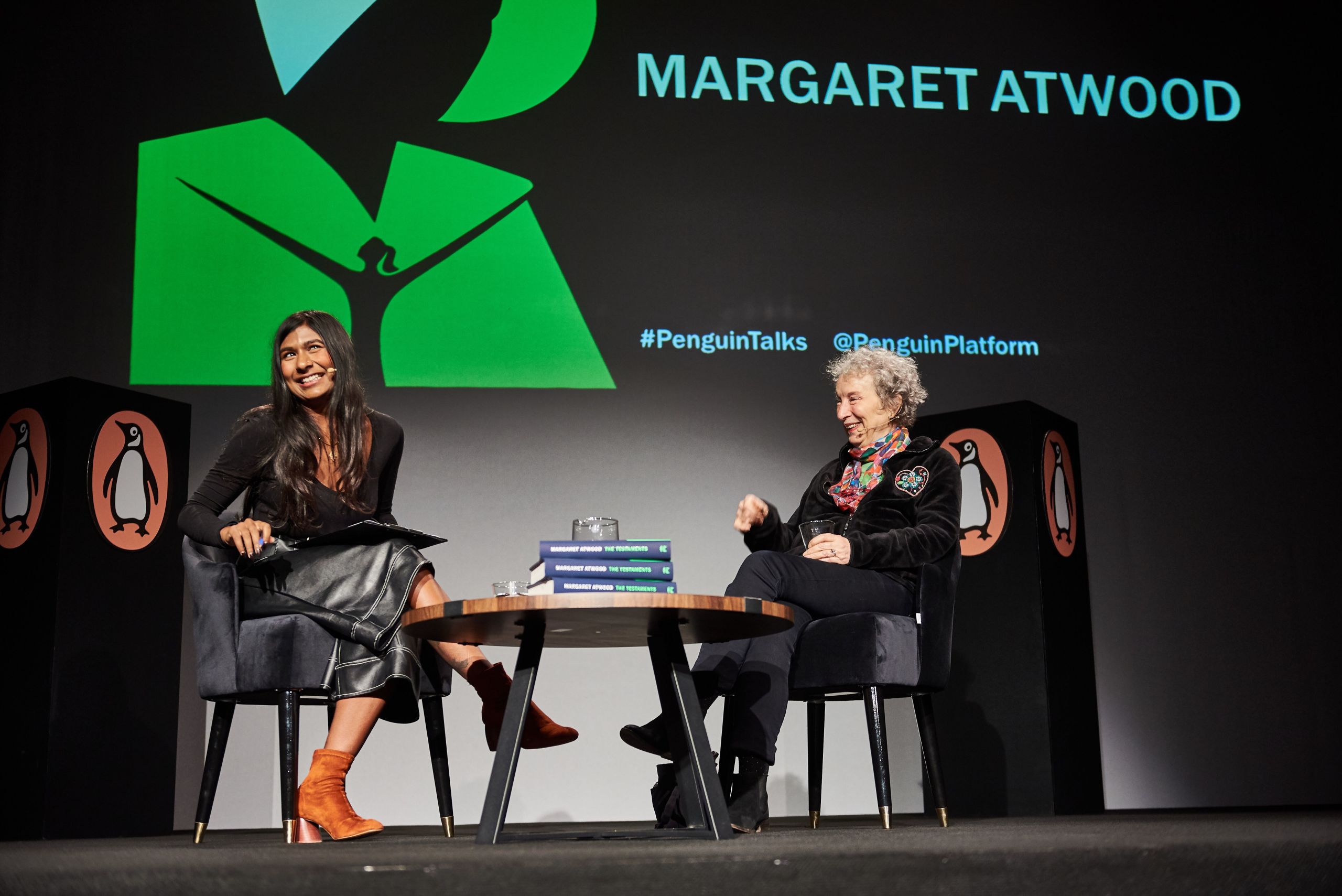Ash Sarkar and Margaret Atwood laughing together onstage at Penguin Talks.