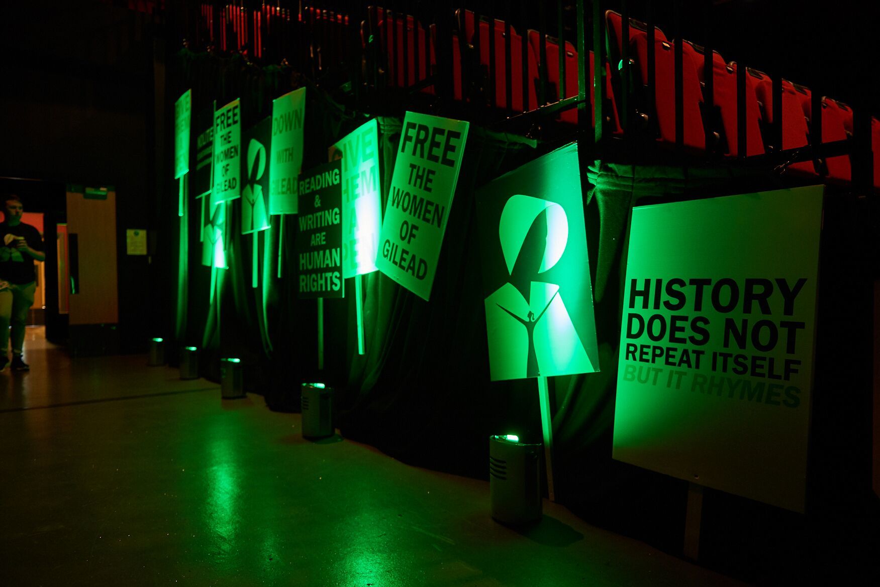 Placards with messages from The Testaments set up in the lecture hall.